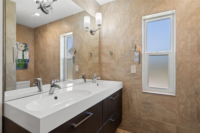 261 Kentucky Ave, Crystal Beach, FL 34681 - bathroom with tile walls and double vanity