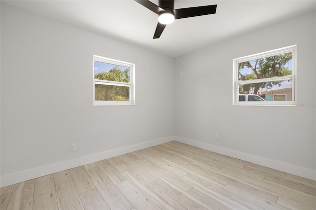 2157 20th Ave SW, Largo, FL 33774 - empty room featuring baseboards, a ceiling fan, and wood finished floors
