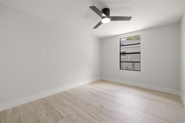 2157 20th Ave SW, Largo, FL 33774 - spare room featuring wood finished floors, ceiling fan, and baseboards