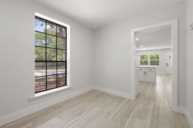 2157 20th Ave SW, Largo, FL 33774 - unfurnished room with baseboards, light wood-type flooring, and recessed lighting