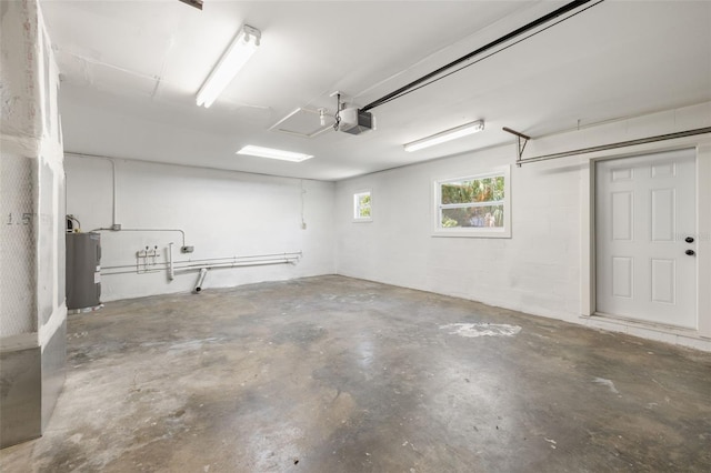 2157 20th Ave SW, Largo, FL 33774 - garage with electric water heater and a garage door opener