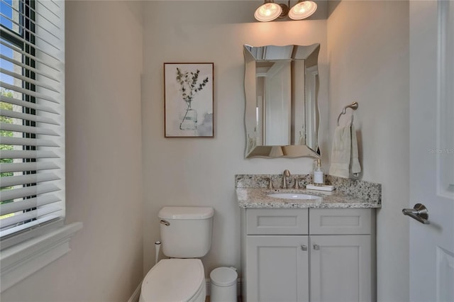 half bath with toilet and vanity