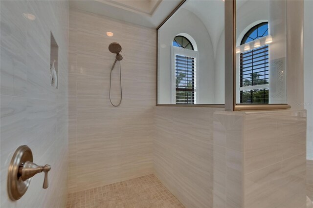 bathroom with tiled shower