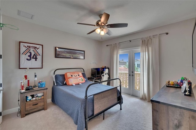 bedroom featuring access to outside, light colored carpet, french doors, a ceiling fan, and baseboards