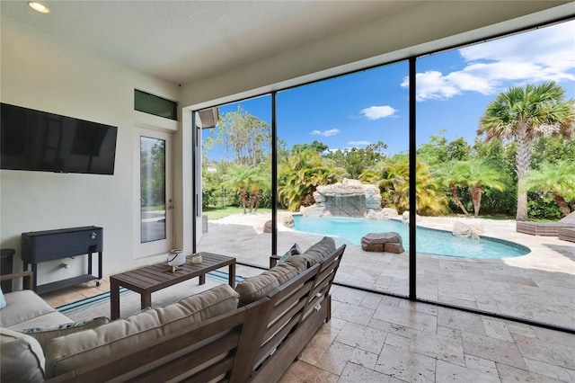 living room featuring stone tile flooring and recessed lighting