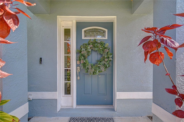 7107 Colonial Lake Dr, Riverview, FL 33578 - doorway to property featuring stucco siding