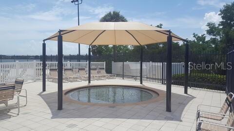 7107 Colonial Lake Dr, Riverview, FL 33578 - view of patio featuring a fenced backyard and a community pool