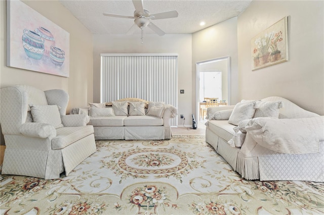 6237 Greenwich Dr, Tampa, FL 33647 - carpeted living area featuring a ceiling fan and a textured ceiling