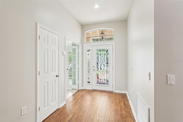 10150 Heather Sound Dr, Tampa, FL 33647 - foyer entrance with baseboards, wood finished floors, and recessed lighting