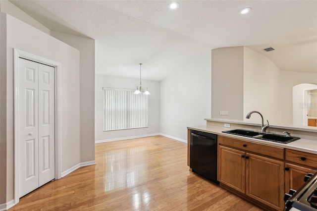 10150 Heather Sound Dr, Tampa, FL 33647 - kitchen with a sink, dishwasher, brown cabinetry, a chandelier, and vaulted ceiling