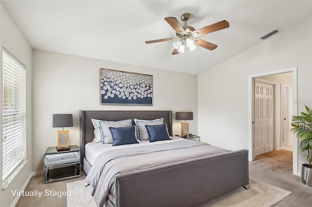 10150 Heather Sound Dr, Tampa, FL 33647 - carpeted bedroom with lofted ceiling, a ceiling fan, and baseboards