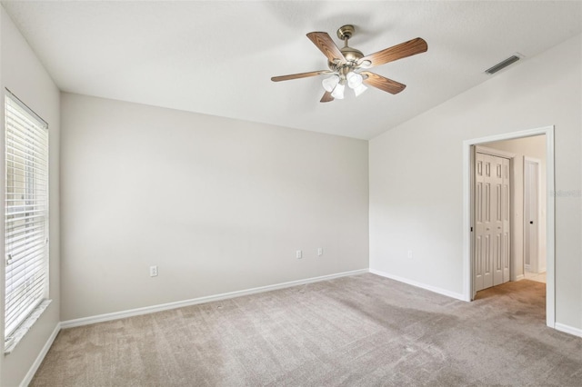 10150 Heather Sound Dr, Tampa, FL 33647 - unfurnished bedroom with carpet flooring, lofted ceiling, baseboards, and a ceiling fan