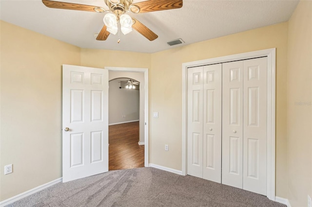 10150 Heather Sound Dr, Tampa, FL 33647 - unfurnished bedroom with carpet floors, baseboards, a closet, and ceiling fan