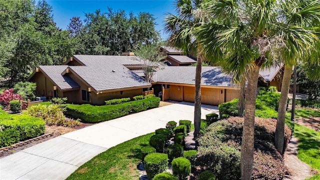 29903 Baywood Ln, Wesley Chapel, FL 33543 - single story home featuring a garage, a tile roof, driveway, and stucco siding