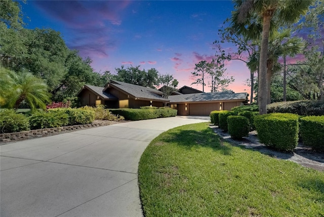 29903 Baywood Ln, Wesley Chapel, FL 33543 - view of front of home with an attached garage, driveway, and a lawn