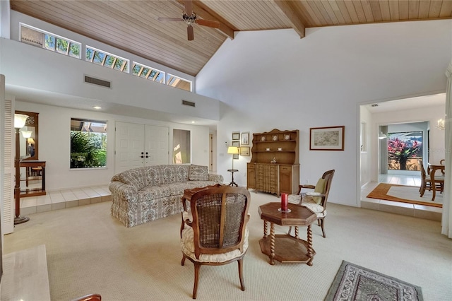 29903 Baywood Ln, Wesley Chapel, FL 33543 - living area with carpet, wood ceiling with exposed beams, ceiling fan, and high vaulted ceiling
