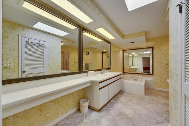 29903 Baywood Ln, Wesley Chapel, FL 33543 - full bathroom with a garden tub, a skylight, vanity, and wallpapered walls