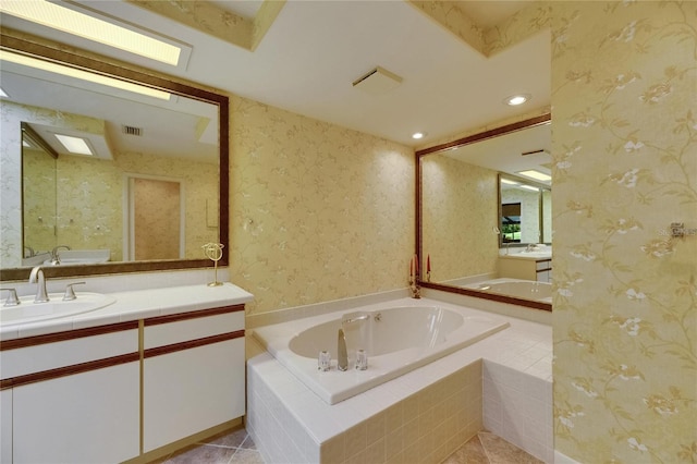 29903 Baywood Ln, Wesley Chapel, FL 33543 - bathroom with a garden tub, vanity, recessed lighting, wallpapered walls, and tile patterned floors