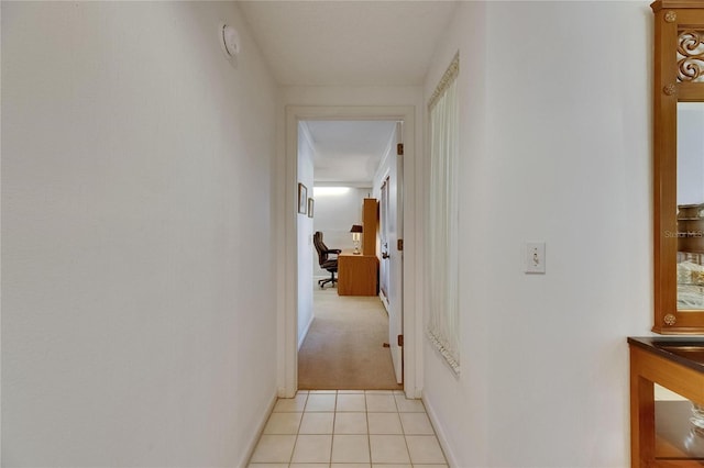 29903 Baywood Ln, Wesley Chapel, FL 33543 - hallway with light tile patterned flooring, light carpet, and baseboards