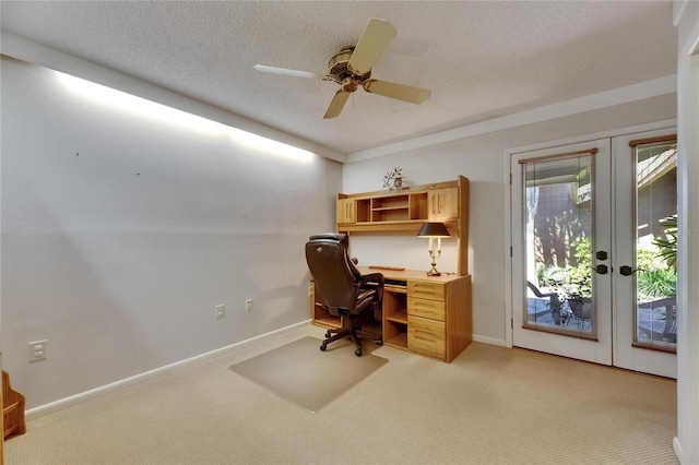 29903 Baywood Ln, Wesley Chapel, FL 33543 - office area featuring french doors, light carpet, a textured ceiling, ceiling fan, and baseboards