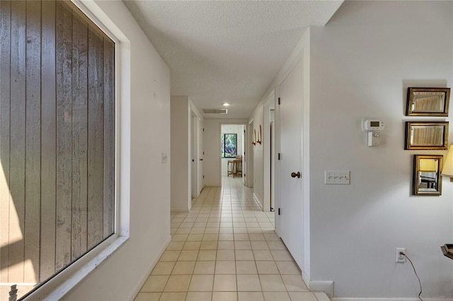 29903 Baywood Ln, Wesley Chapel, FL 33543 - hallway with light tile patterned flooring and baseboards