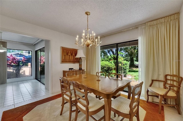 29903 Baywood Ln, Wesley Chapel, FL 33543 - dining space with a chandelier and a textured ceiling