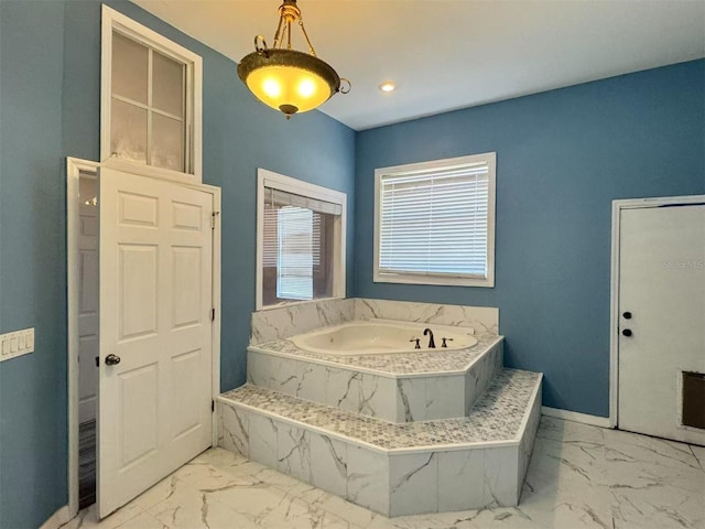 full bathroom with marble finish floors, a garden tub, baseboards, and recessed lighting
