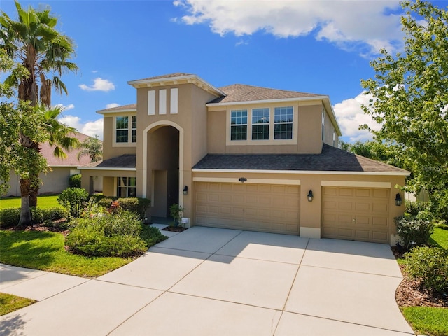 10837 Breaking Rocks Dr, Tampa, FL 33647 - view of front of home featuring concrete driveway, a garage, and stucco siding