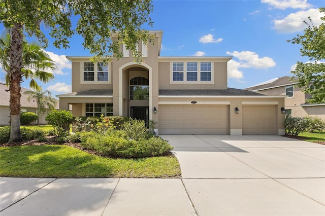 10837 Breaking Rocks Dr, Tampa, FL 33647 - view of front of house with stucco siding, concrete driveway, and an attached garage