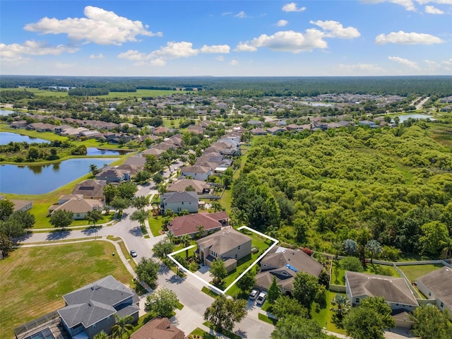 10837 Breaking Rocks Dr, Tampa, FL 33647 - aerial perspective of suburban area featuring property parcel outlined and a nearby body of water
