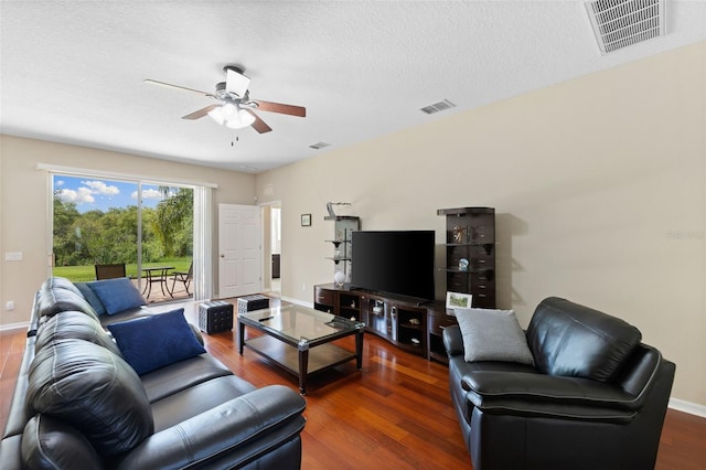 10837 Breaking Rocks Dr, Tampa, FL 33647 - living room with a ceiling fan, wood finished floors, baseboards, and a textured ceiling
