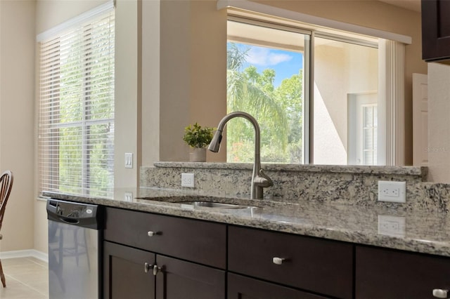10837 Breaking Rocks Dr, Tampa, FL 33647 - kitchen with dishwasher, a sink, light stone counters, and healthy amount of natural light