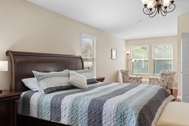 10837 Breaking Rocks Dr, Tampa, FL 33647 - bedroom featuring a chandelier, wood finished floors, and baseboards
