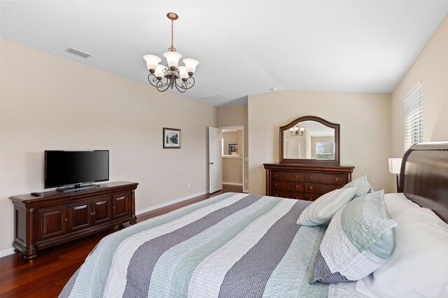 10837 Breaking Rocks Dr, Tampa, FL 33647 - bedroom with a chandelier, dark wood finished floors, baseboards, and lofted ceiling