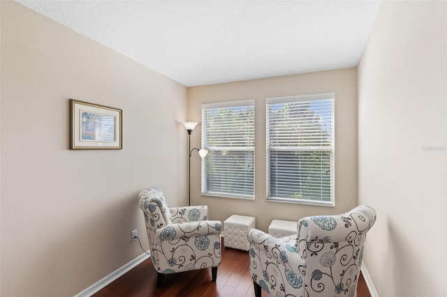 10837 Breaking Rocks Dr, Tampa, FL 33647 - living area with baseboards and dark wood-style floors