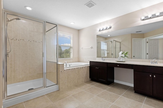 10837 Breaking Rocks Dr, Tampa, FL 33647 - full bathroom featuring tile patterned flooring, a shower stall, a bath, and recessed lighting