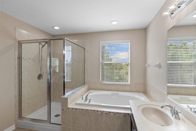 10837 Breaking Rocks Dr, Tampa, FL 33647 - bathroom with a stall shower, a garden tub, recessed lighting, and vanity