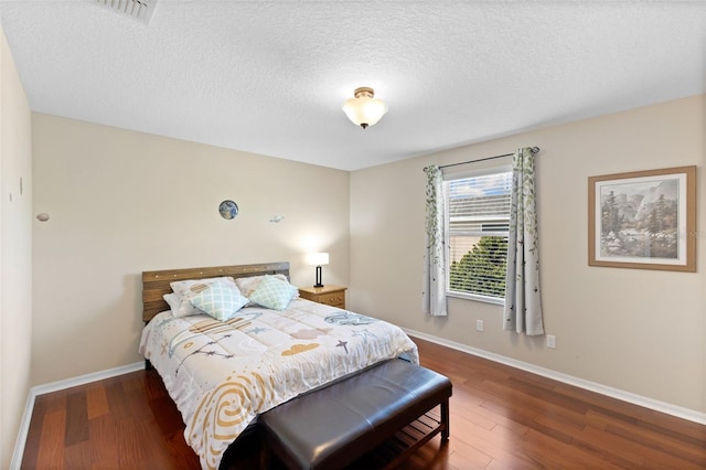 10837 Breaking Rocks Dr, Tampa, FL 33647 - bedroom with wood finished floors, baseboards, and a textured ceiling