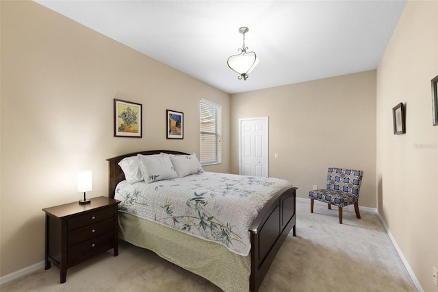 10837 Breaking Rocks Dr, Tampa, FL 33647 - bedroom with light colored carpet, baseboards, and a closet