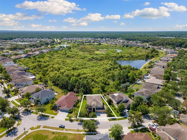 10837 Breaking Rocks Dr, Tampa, FL 33647 - aerial perspective of suburban area with property boundaries highlighted and a large body of water
