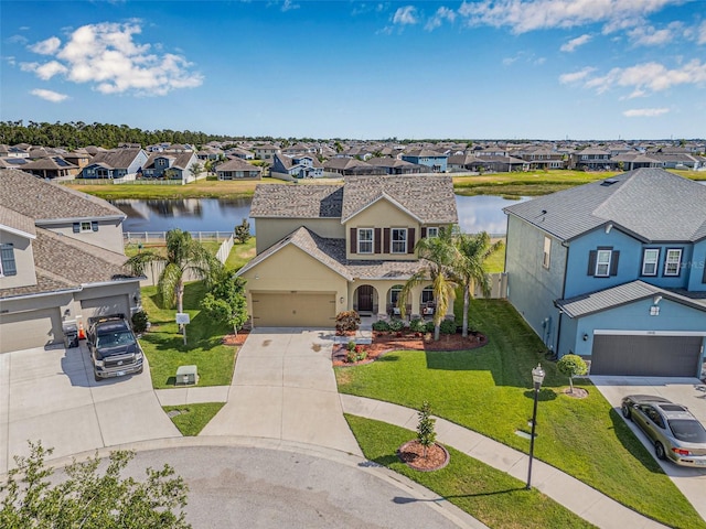 11917 Greenchop Pl, Riverview, FL 33579 - traditional home featuring a residential view, a water view, driveway, and a front lawn