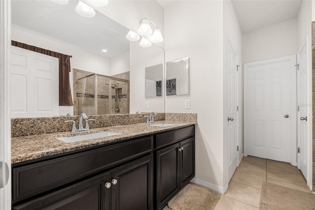 11917 Greenchop Pl, Riverview, FL 33579 - full bath featuring a shower stall, double vanity, tile patterned flooring, and baseboards