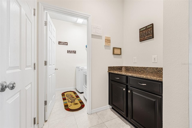 11917 Greenchop Pl, Riverview, FL 33579 - laundry room featuring independent washer and dryer, light tile patterned floors, and baseboards