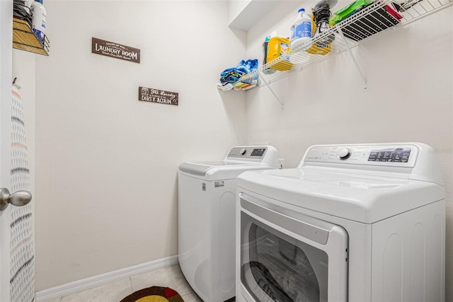 11917 Greenchop Pl, Riverview, FL 33579 - washroom with washer and clothes dryer, tile patterned flooring, and baseboards