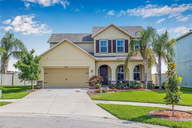 11917 Greenchop Pl, Riverview, FL 33579 - traditional-style home featuring stucco siding, concrete driveway, a garage, a porch, and a shingled roof