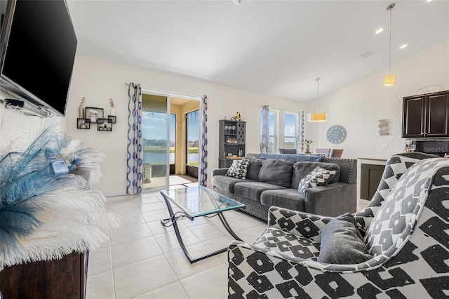 11917 Greenchop Pl, Riverview, FL 33579 - living area featuring vaulted ceiling, light tile patterned flooring, and a water view