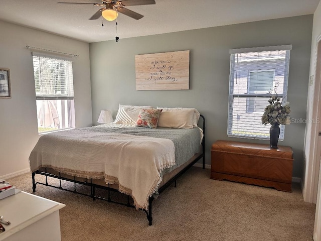 2987 Neverland Dr, New Smyrna Beach, FL 32168 - bedroom featuring carpet flooring, baseboards, and ceiling fan