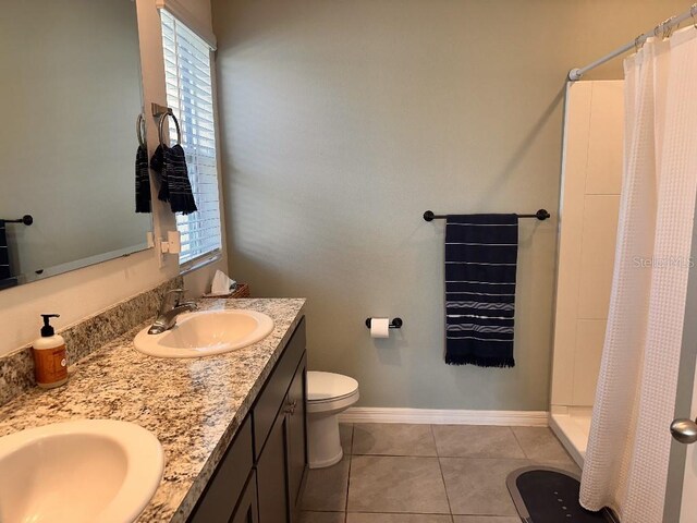 2987 Neverland Dr, New Smyrna Beach, FL 32168 - bathroom featuring healthy amount of natural light, toilet, tile patterned floors, and a stall shower