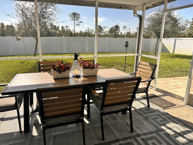 2987 Neverland Dr, New Smyrna Beach, FL 32168 - sunroom with outdoor dining area