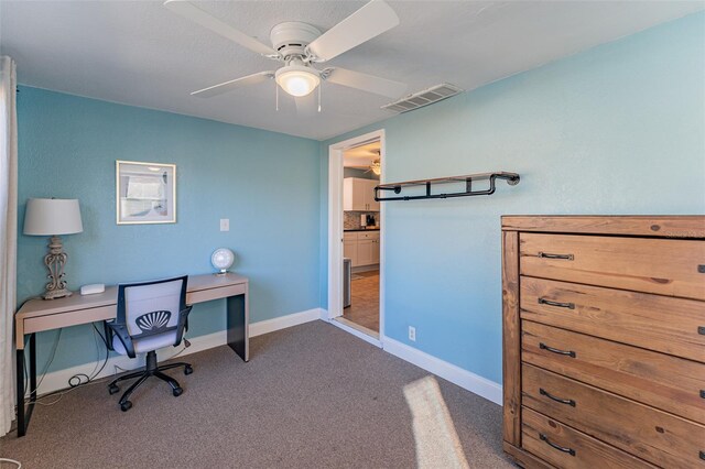 2035 29th Ave N, Saint Petersburg, FL 33713 - office featuring dark colored carpet, ceiling fan, and baseboards
